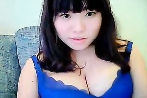 Cute dilettante dark brown Asian model girl on cam teases me with her tits
