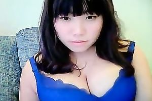 Cute dilettante dark brown Asian model girl on cam teases me with her tits