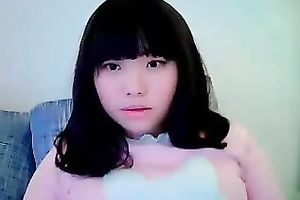 Cute dilettante dark brown Asian model girl on cam teases me with her tits
