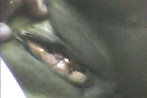 Stretching dark girl's anus with large sex toy