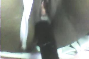 Stretching dark girl's anus with large sex toy