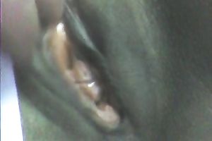 Stretching dark girl's anus with large sex toy