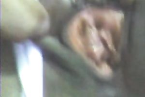 Stretching dark girl's anus with large sex toy