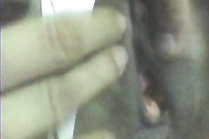 Stretching dark girl's anus with large sex toy