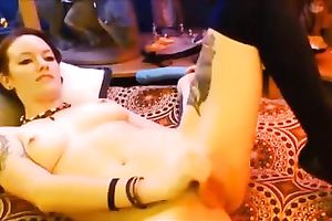 Brunette model with charming smile pokes her constricted holes