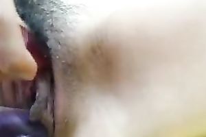 Horny paramour toying her pussy with large sex toy