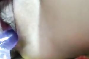 Horny paramour toying her pussy with large sex toy