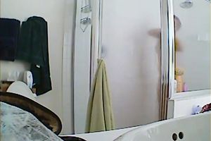 Appetizing breasty hottie taking a shower hidden webcam sex clip
