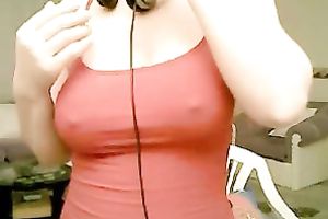 Lascivious livecam model is playing with her large saggy melons