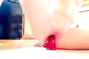 Spoiled legal age teenager with flat scones riding giant sex toy on a floor