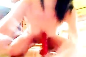 Spoiled legal age teenager with flat scones riding giant sex toy on a floor