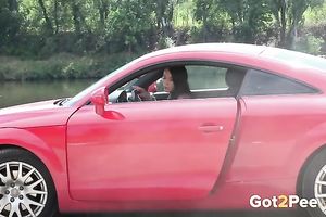 Exquisite elegant rich housewife in fancy red car pissing