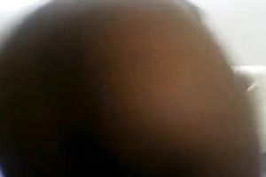 Black milf hoodrat is enchanting herself with a pink marital-device