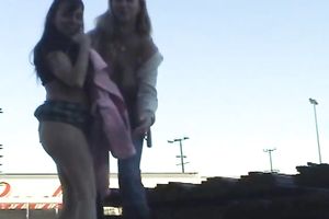 Two skanky older lesbian babes show off their goodies outdoors