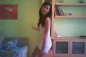 Svelte black haired livecam floozy in taut white costume was dancing on cam