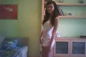 Svelte black haired livecam floozy in taut white costume was dancing on cam