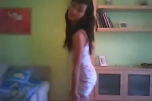 Svelte black haired livecam floozy in taut white costume was dancing on cam
