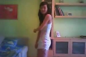 Svelte black haired livecam floozy in taut white costume was dancing on cam