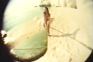 Sweet dark brown cutie rides her boyfriend on the beach