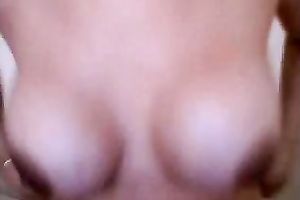 This sexy dilettante white lady shows off her large fake knockers on webcam