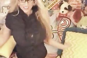 Mature blondie with gigantic tits flaunts 'em on web camera