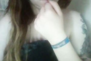 Red haired legal age teenager playing with her milk shakes sensually