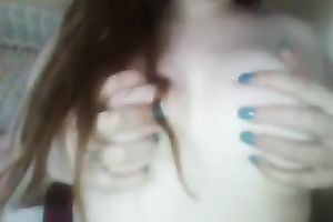 Red haired legal age teenager playing with her milk shakes sensually