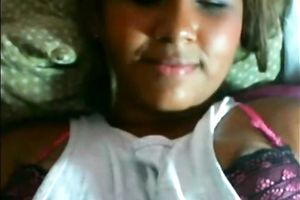 Hot black skin cutie on her daybed flashing her slit on cam