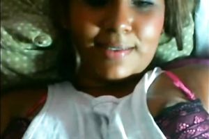 Hot black skin cutie on her daybed flashing her slit on cam