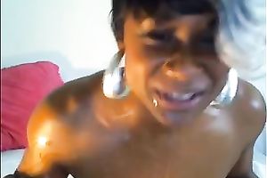 Filthy and pumped up dark bitch in front of web camera engulfing white 10-Pounder