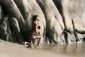 Knock-out beauty Racquel copulates passionately on a beach below the open sky