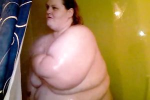 Morbidly bulky SBBW redhead girlfriend takes shower