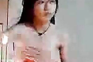 Just a cute and slender Asian legal age teenager on hidden web camera stripteasing