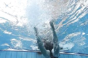Cute and playful dark brown Russian skank in the pool