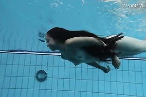 Cute and playful dark brown Russian skank in the pool