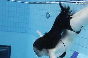 Cute and playful dark brown Russian skank in the pool