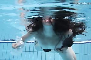 Cute and playful dark brown Russian skank in the pool