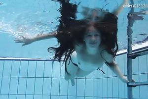 Cute and playful dark brown Russian skank in the pool