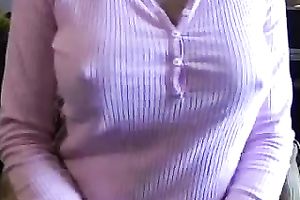 The teats of this breasty milfie push throughout her shirt