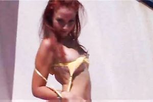 Mega sexy redhead juvenile honey showing off her body outside