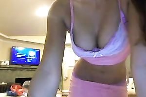 Posing on a web camera being topless