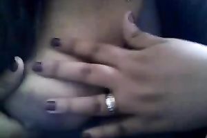 Bored serious looking web camera fatso rubs her puffy teats and milk cans