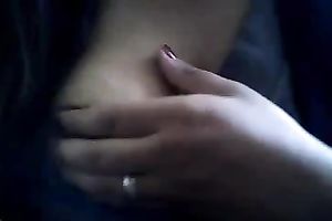 Bored serious looking web camera fatso rubs her puffy teats and milk cans