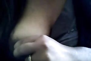 Bored serious looking web camera fatso rubs her puffy teats and milk cans