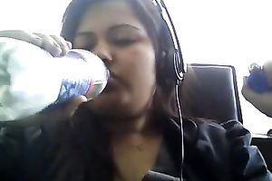 Bored serious looking web camera fatso rubs her puffy teats and milk cans