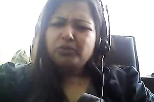 Bored serious looking web camera fatso rubs her puffy teats and milk cans