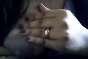 Bored serious looking web camera fatso rubs her puffy teats and milk cans