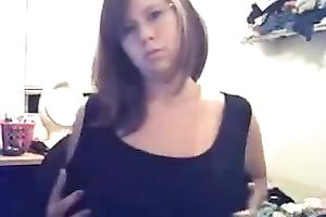 Tempestuous girlfriend kneading huge boobies in front of camera