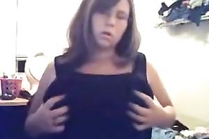 Tempestuous girlfriend kneading huge boobies in front of camera