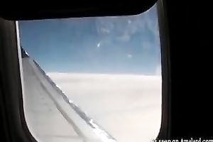 Lovely and sexually excited blond sweetheart on the plane flashing and masturbating